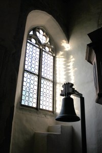 Window and bell at a chapel in Germany